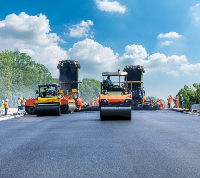 Construction,Site,Is,Laying,New,Asphalt,Pavement,,Road,Construction,Workers