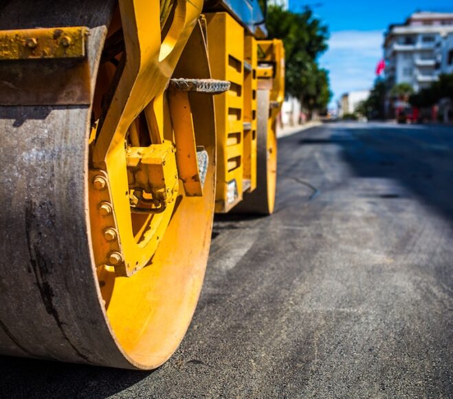 Roadworks, rolling a new layer of the road.
