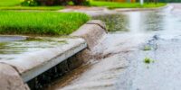 Stormwater,Flowing,Into,Street,Intake,Drain,After,A,Rainstorm