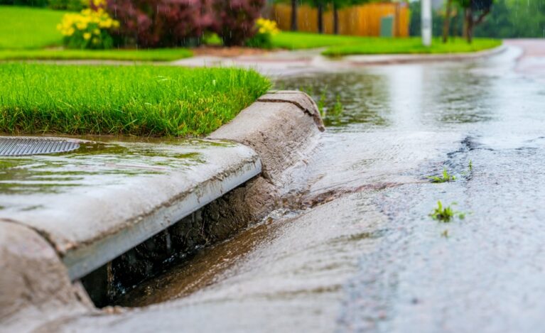 Stormwater,Flowing,Into,Street,Intake,Drain,After,A,Rainstorm
