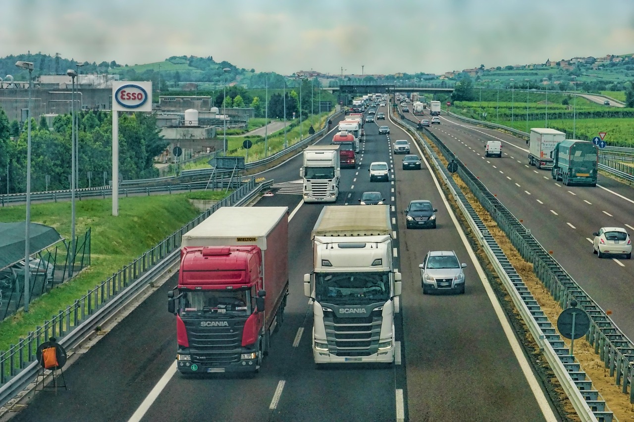 A busy highway with various types of vehicles