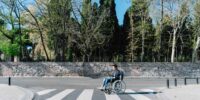 little-boy-in-wheelchair-crossing-the-street-2025-02-13-19-56-37-utc_11zon