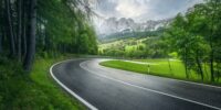 Road,In,Green,Forest,In,Rainy,Summer,Day.,Dolomites,,Italy.