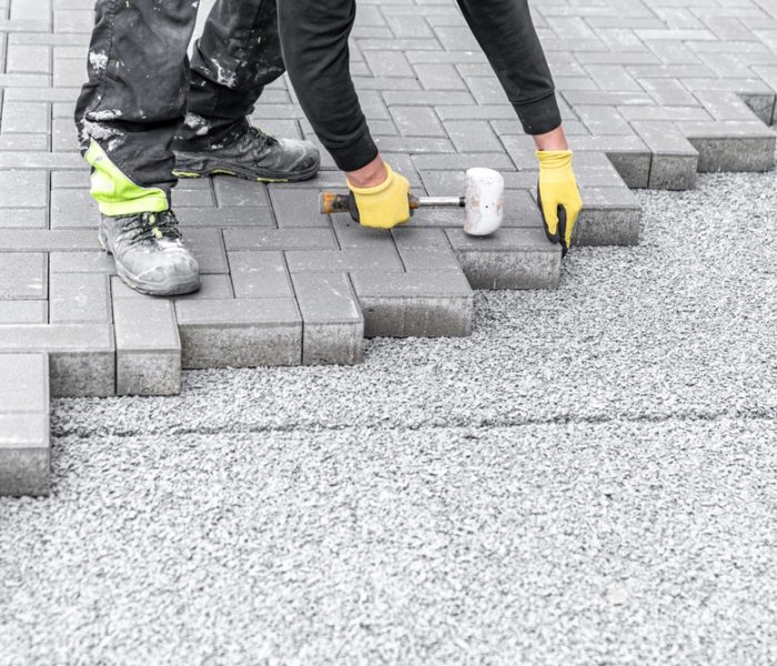 Laying,Interlocking,Pavers,During,The,Construction,Of,Sidewalks,And,Roads