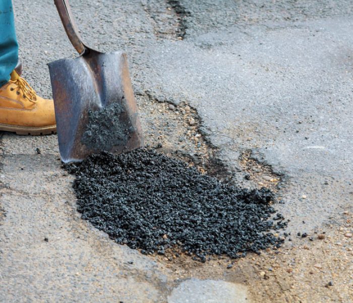 laying-new-asphalt-covering-the-pit-hole-in-asph-2025-03-27-03-41-47-utc