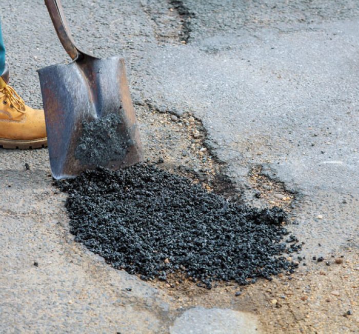 laying-new-asphalt-covering-the-pit-hole-in-asph-2025-03-27-03-41-47-utc